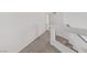 Upstairs hallway with neutral carpeting and access to bedrooms at 7075 Jasper Hill Way, Las Vegas, NV 89118