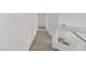 Upstairs hallway features carpet flooring, white walls, and modern railing at 7075 Jasper Hill Way, Las Vegas, NV 89118