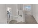 Bright hallway features neutral carpeting and a window with lots of natural light at 7075 Jasper Hill Way, Las Vegas, NV 89118