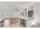 Modern kitchen features stainless steel appliances and island seating at 7075 Jasper Hill Way, Las Vegas, NV 89118