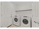 Convenient laundry room with modern washer and dryer and ample storage space at 7075 Jasper Hill Way, Las Vegas, NV 89118