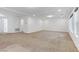 Large living room with neutral carpet, recessed lighting, and ample natural light at 7075 Jasper Hill Way, Las Vegas, NV 89118