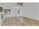 Living room with hardwood floors and ceiling fan at 7075 Jasper Hill Way, Las Vegas, NV 89118