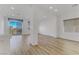 Living area with wood-look floors and sliding glass doors at 7075 Jasper Hill Way, Las Vegas, NV 89118