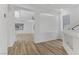Bright living area with wood flooring and white interior showcasing the modern design at 7075 Jasper Hill Way, Las Vegas, NV 89118