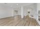Expansive living space with wood floors, recessed lighting, and neutral color palette at 7075 Jasper Hill Way, Las Vegas, NV 89118