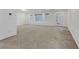 Open living space with plush carpeting, natural light and recessed lighting at 7075 Jasper Hill Way, Las Vegas, NV 89118