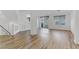 Spacious living area boasting wood flooring, bright windows, and a modern design at 7075 Jasper Hill Way, Las Vegas, NV 89118