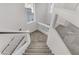 Modern glass and metal staircase leading to the upper level at 7075 Jasper Hill Way, Las Vegas, NV 89118