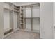 Walk-in closet with custom shelving and ample storage space at 7075 Jasper Hill Way, Las Vegas, NV 89118