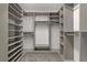 Spacious walk-in closet with custom built-in shelving at 7075 Jasper Hill Way, Las Vegas, NV 89118