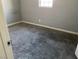 Grey carpeted bedroom with a window at 721 N 1St St, Las Vegas, NV 89101