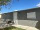 Rear view of a single story house with a small window and door at 721 N 1St St, Las Vegas, NV 89101