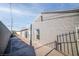 Side view of a house with a walkway and gray brick exterior at 721 N 1St St, Las Vegas, NV 89101