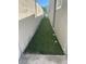 Long, narrow side yard with artificial turf at 721 N 1St St, Las Vegas, NV 89101