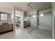 Modern bathroom with walk-in shower and double vanity at 7310 Heron Canyon Ct, Las Vegas, NV 89117