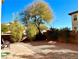 Landscaped backyard with gravel and some trees at 7529 Earnshaw Ave, Las Vegas, NV 89149