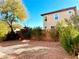 Spacious backyard with gravel and some trees at 7529 Earnshaw Ave, Las Vegas, NV 89149