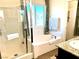 Elegant bathroom with a shower, soaking tub, and granite vanity at 7529 Earnshaw Ave, Las Vegas, NV 89149