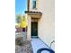 Dark green front door with a walkway and stone landscaping at 7529 Earnshaw Ave, Las Vegas, NV 89149