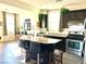 Kitchen island with granite countertops and dark wood cabinets at 7529 Earnshaw Ave, Las Vegas, NV 89149