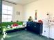 Serene living room with a green sofa and decorative items at 7529 Earnshaw Ave, Las Vegas, NV 89149