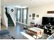 Living room with large windows and a statement coffee table at 7529 Earnshaw Ave, Las Vegas, NV 89149