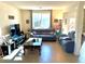 Living room with gray sofas, coffee table, and view into kitchen area at 7529 Earnshaw Ave, Las Vegas, NV 89149