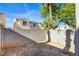 Small, enclosed backyard with block walls at 7741 Orchard Wood Ct, Las Vegas, NV 89131