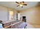 Bedroom with en-suite bathroom and a tv at 7741 Orchard Wood Ct, Las Vegas, NV 89131