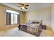 Spacious bedroom with large window and king-size bed at 7741 Orchard Wood Ct, Las Vegas, NV 89131