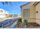 Landscaped front yard with walkway and agave plant at 7741 Orchard Wood Ct, Las Vegas, NV 89131