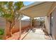 Covered patio with flagstone and small desert landscape at 7741 Orchard Wood Ct, Las Vegas, NV 89131