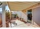 Covered patio with flagstone flooring and small yard at 7741 Orchard Wood Ct, Las Vegas, NV 89131