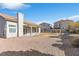 Spacious backyard with covered patio and gravel at 7859 Lisa Marie Ct, Las Vegas, NV 89113