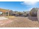 Backyard with covered patio and gravel at 7859 Lisa Marie Ct, Las Vegas, NV 89113