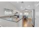 Kitchen with granite countertops, stainless steel appliances, and wood flooring at 7859 Lisa Marie Ct, Las Vegas, NV 89113