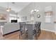 Open living space with hardwood floors and a gray couch at 7859 Lisa Marie Ct, Las Vegas, NV 89113