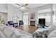 Spacious living room featuring hardwood floors, fireplace and ample natural light at 7859 Lisa Marie Ct, Las Vegas, NV 89113