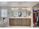 Double vanity bathroom with a large mirror and walk-in closet at 8035 Skye Foxx St, Las Vegas, NV 89166