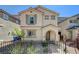 Two-story house with gray exterior and a brown door at 8035 Skye Foxx St, Las Vegas, NV 89166