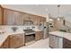 Modern kitchen with stainless steel appliances and white quartz countertops at 8035 Skye Foxx St, Las Vegas, NV 89166