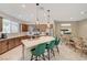 Modern kitchen with a large island and seating for four at 8035 Skye Foxx St, Las Vegas, NV 89166