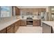 Modern kitchen with stainless steel appliances and white quartz countertops at 8035 Skye Foxx St, Las Vegas, NV 89166