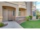 Attractive entryway with landscaping and a brown door at 8805 Jeffreys St # 1032, Las Vegas, NV 89123