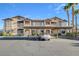 Tan two-story building with carport and palm trees at 8805 Jeffreys St # 1032, Las Vegas, NV 89123