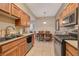 Full view of kitchen with stainless steel appliances and granite counters at 8805 Jeffreys St # 1032, Las Vegas, NV 89123