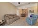 Open living room with dining area and fireplace at 8805 Jeffreys St # 1032, Las Vegas, NV 89123