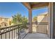 Private balcony with wrought iron railing and community views at 9103 Mcginnis Ave, Las Vegas, NV 89148