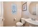 Clean bathroom with toilet, sink, and vanity at 9103 Mcginnis Ave, Las Vegas, NV 89148